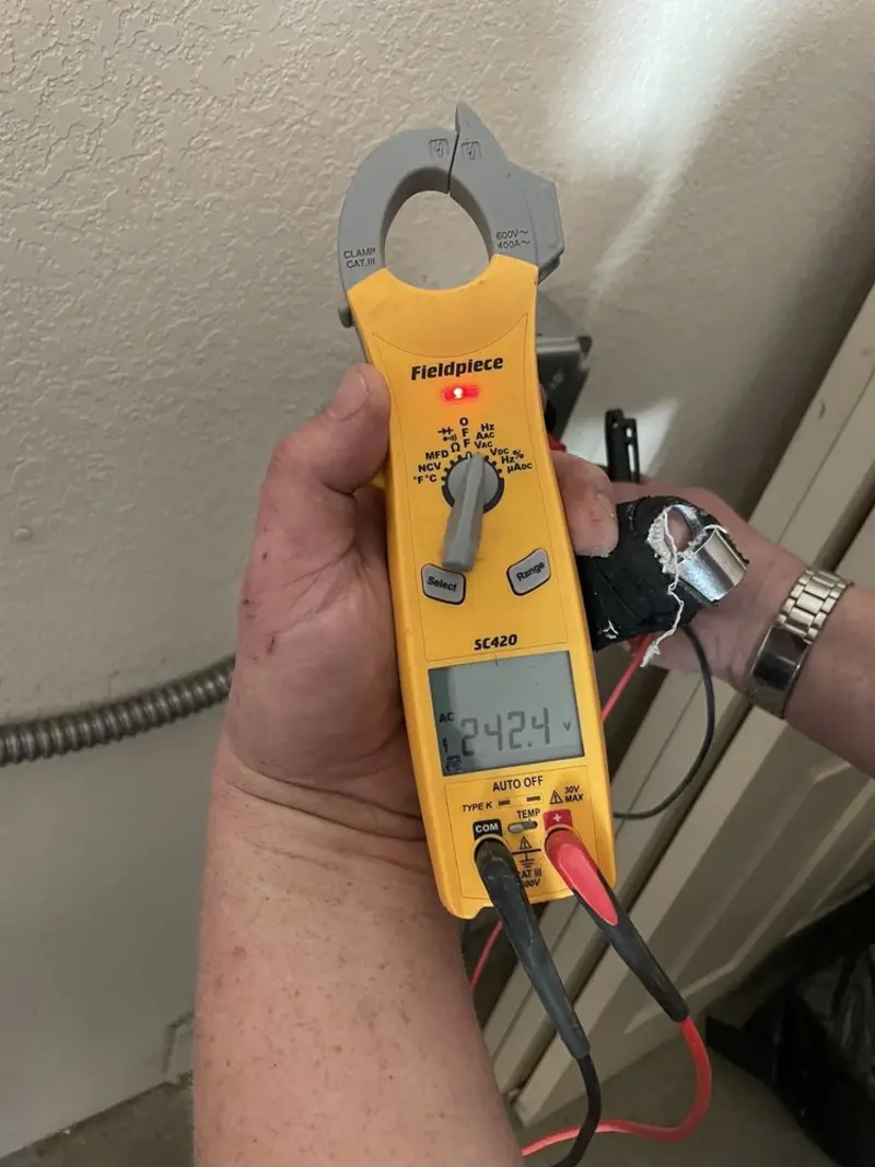Voltage testing with clamp meter during Outlet Installation in Dodgeville